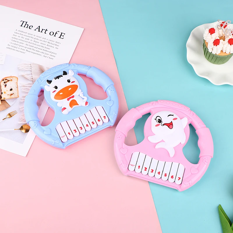 

Мультяшная детская электронная имитация органов, рулевое колесо, музыкальная кнопка для гитары, раннее образование, звуковое крепление, иг...