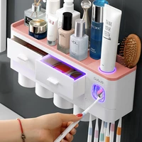 bathroom accessories set magnetic adsorption toothbrush holder automatic toothpaste dispenser with cup wall mount storage rack