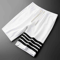 simple european summer thin knitted fabric white casual shorts mens slim trend four bar sports five point pants