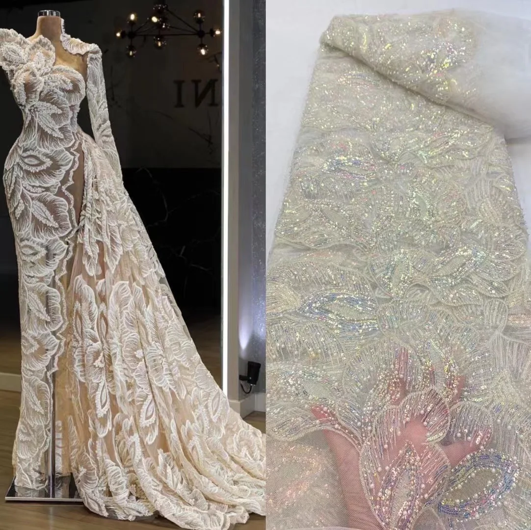 

Latest Handmade Net Mesh Lace Fabrics High Quality 2022 African Beaded Tulle Fabric Embroidery Sequins Lace For Wedding Dresses