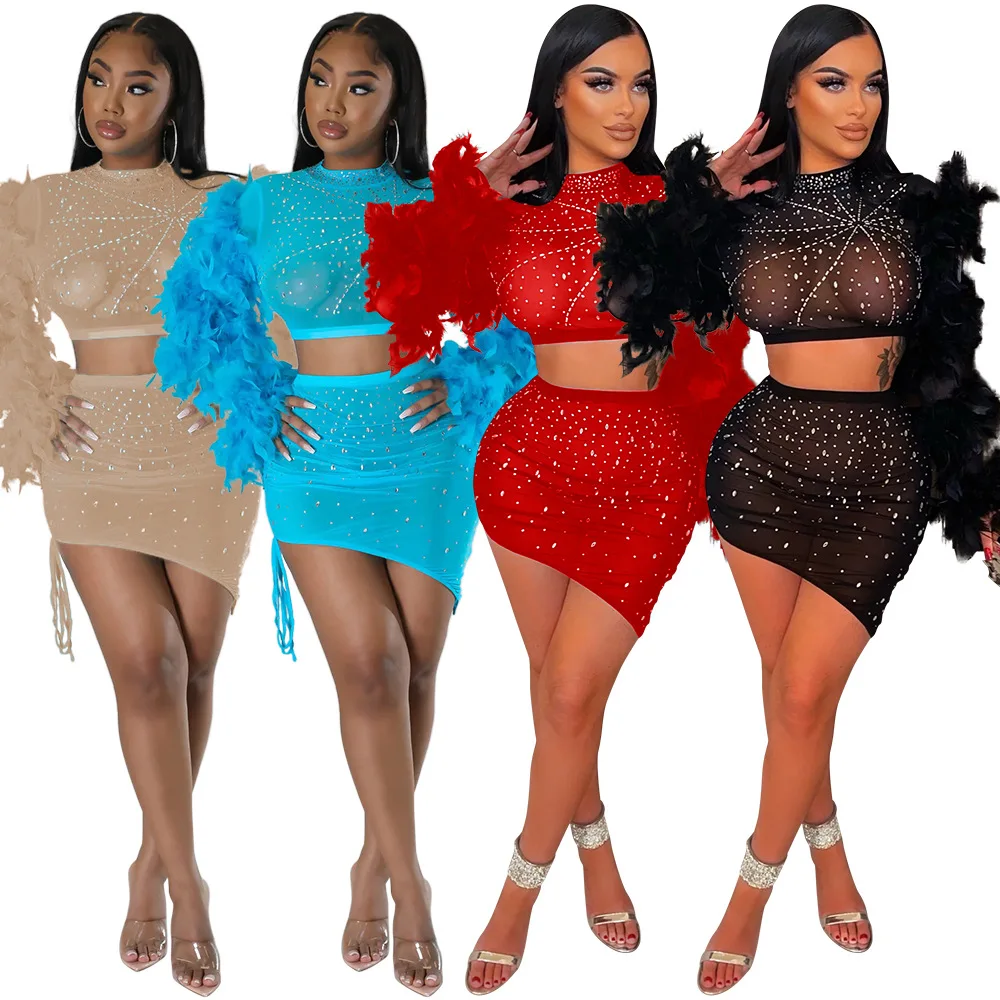 

2022 See Through Sexy Diamonds Two Piece Mesh Sets Women Outfits Feather Long Sleeve Crop Top Bodycon Mini Asymmetrical Skirts