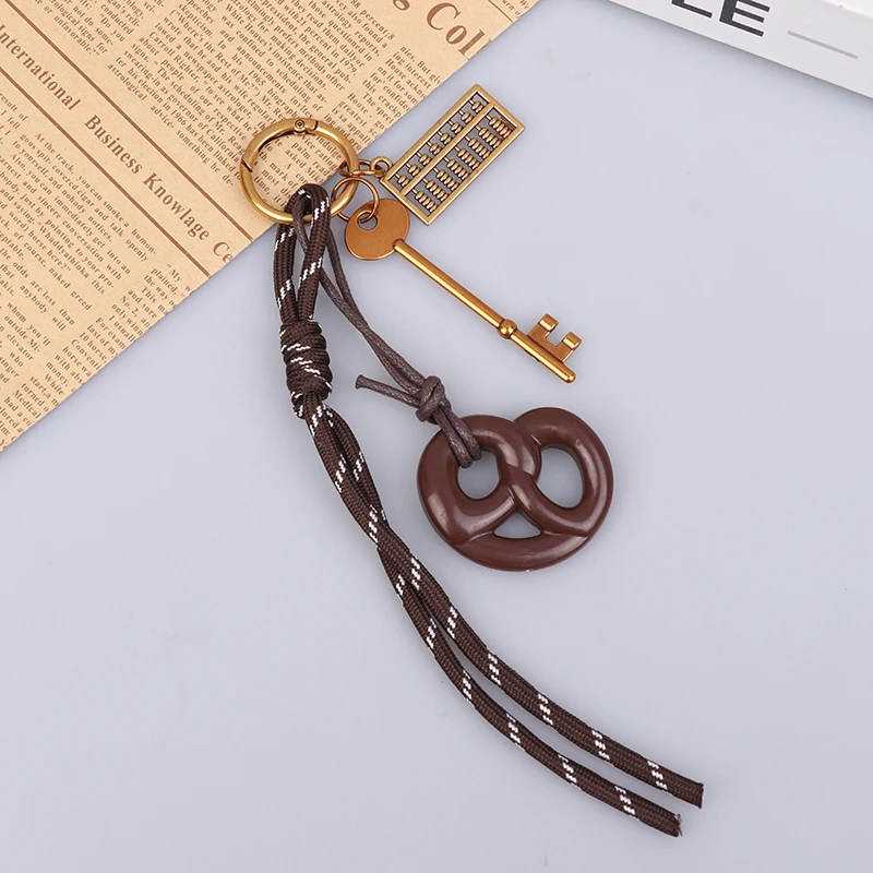 

Брелок из металла и ткани