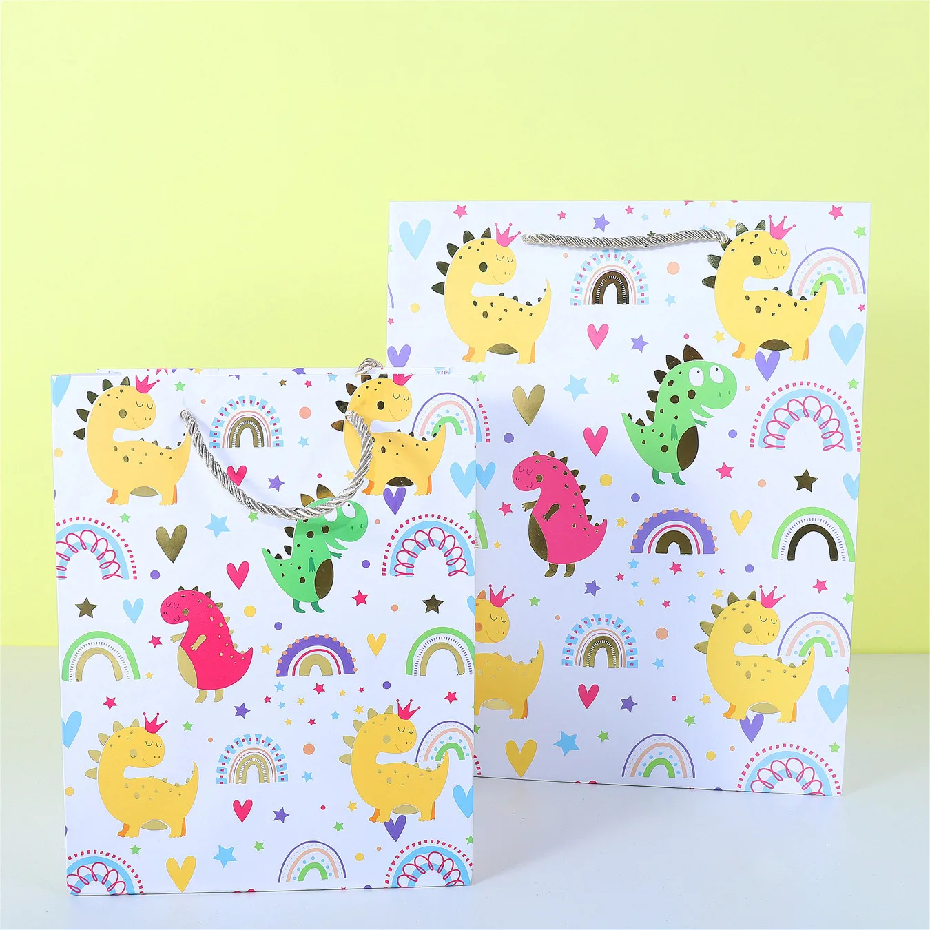 

12PCS Cartoon Dinosaur Favor Gift Paper Bags with Stickers Dino Birthday Candy Packing Gift Bags for Kids Party Supplies