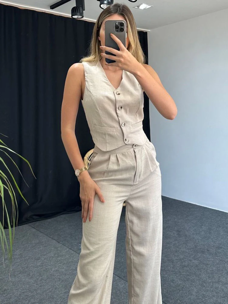 Женский брючный костюм из двух предметов элегантный офисный зеленого цвета с