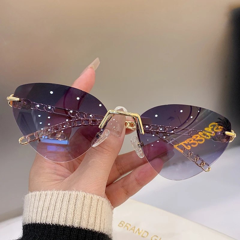 

New Fashion Rimless Cat Eye Women Sunglasses Trendy Luxury Brand Designer Eyewear Colorful Metal Lady Shades for Travelling