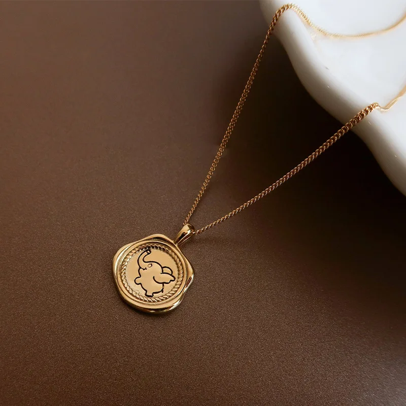 

Retro Harbor Style Small Flying Elephant Necklace Female Irregular Round Brand Pendant Clavicle Chain Simple Design Ins Style