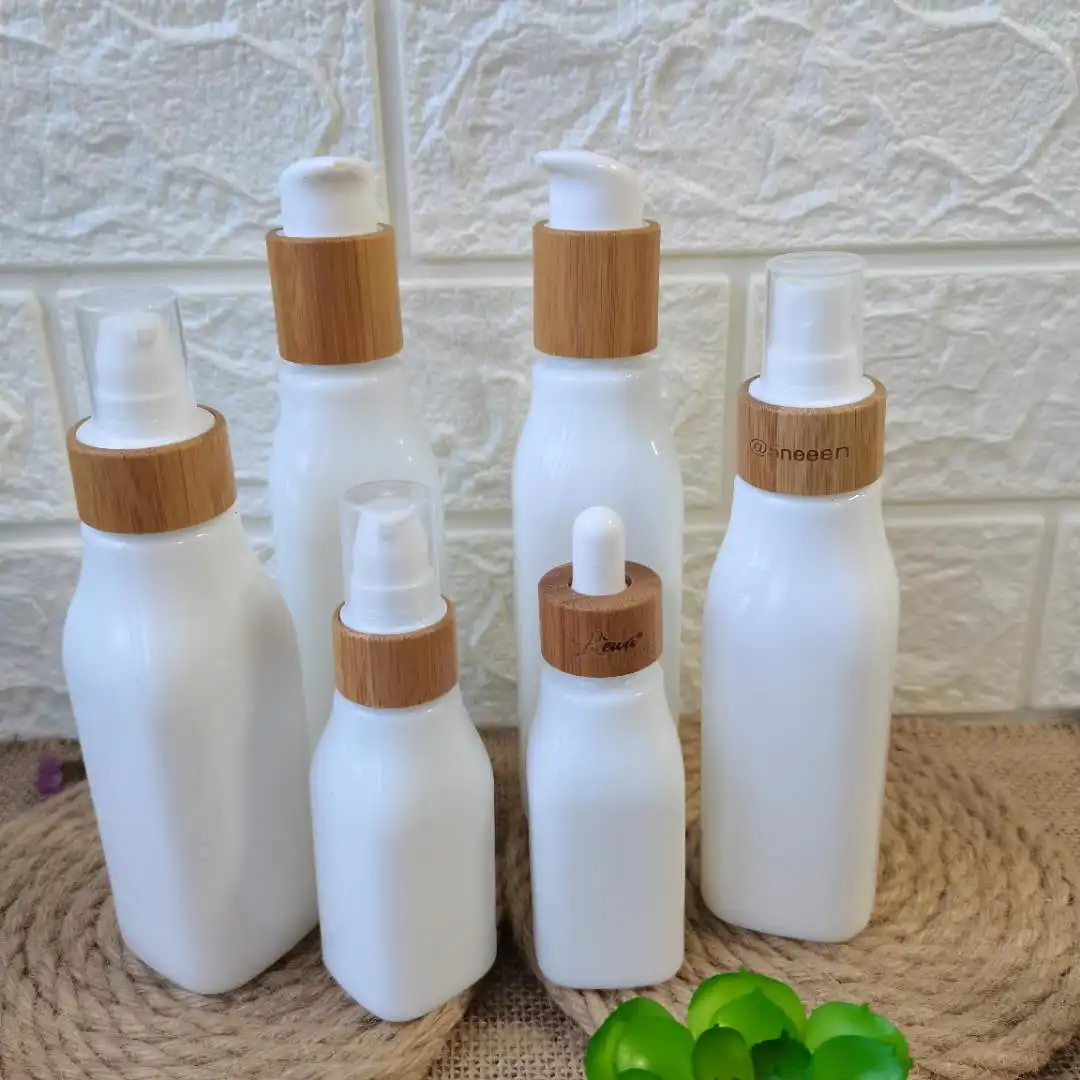 

Wholesale Square Opeal White Serum Glass Bottles with Various Bamboo Lids 40/100/120ml Bamboo Lotion Pump Spray Atomizer DiscTop