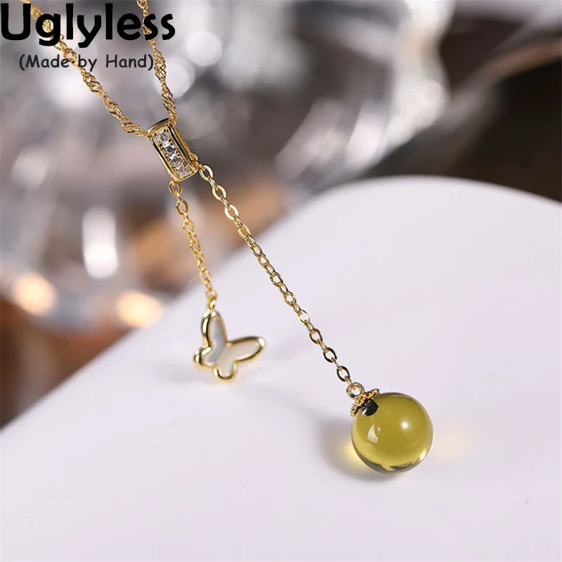 

Uglyless Natural Discolored Blue Amber under UV Lamp Gemstones Necklaces Women 925 Silver Little Boat Butterfly Pendants Shell