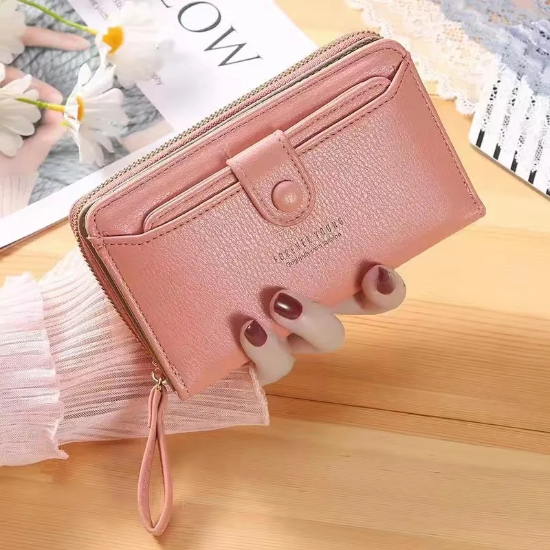 New solid color ladies wrist strap clutch bag fashion Korean version of the long women's zipper wallet large wallet wholesale.