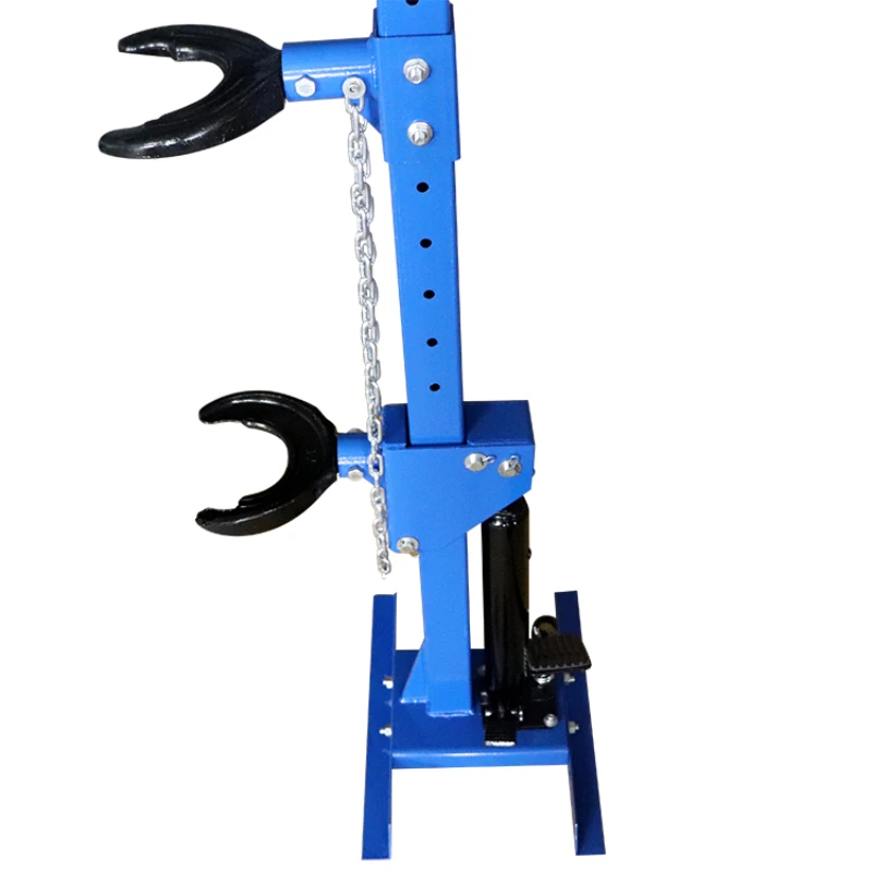 

Air hydraulic tire spring compressor for tire repair