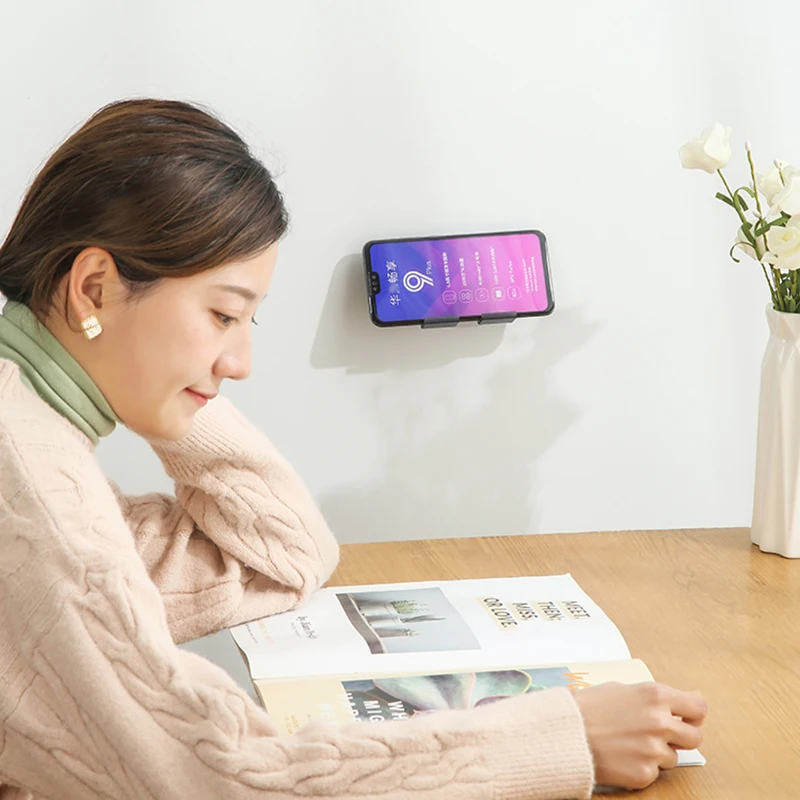 2021 universal wall mounted phone holder bedside mobile phone charging stand shelf non marking sticky wall mounted charging rack free global shipping