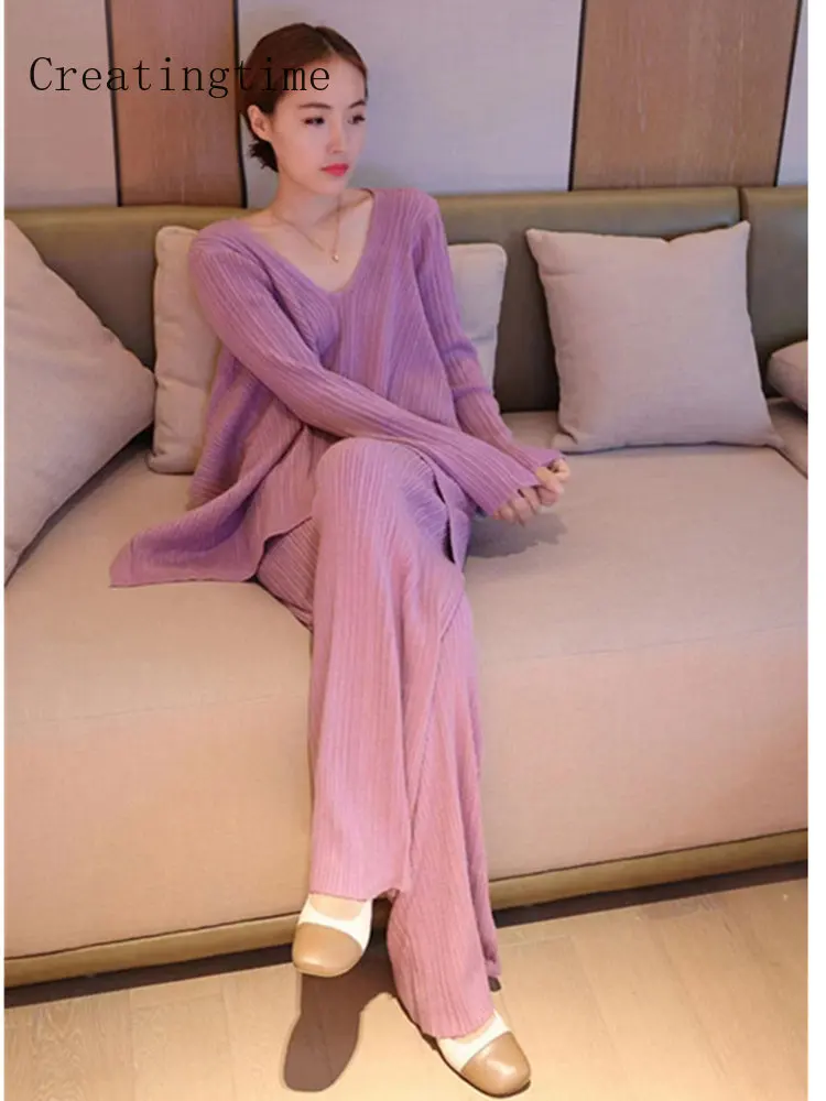 

Женский комплект из двух предметов, трикотажный свитер с V-образным вырезом и брюки с широкими штанинами, модель 1A489 на весну, 2023