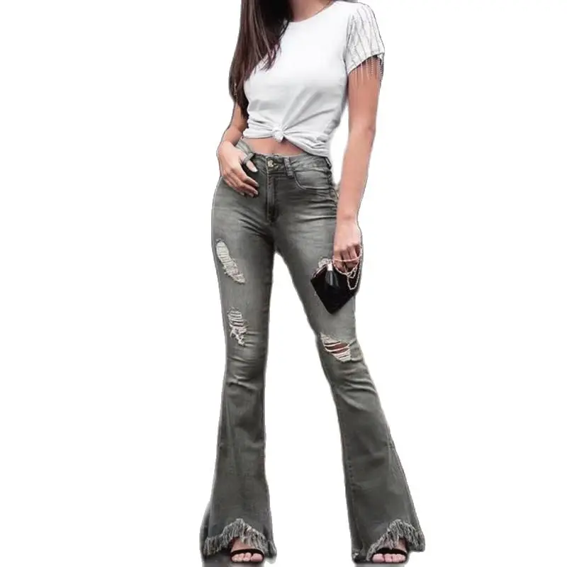 

Классические женские рваные расклешенные джинсы с высокой талией и широкими штанинами