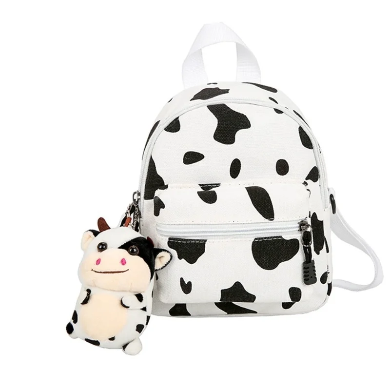 

Mini Canvas Daypack with Plush Pendant Cow Print Backpack for Women Lady Girls