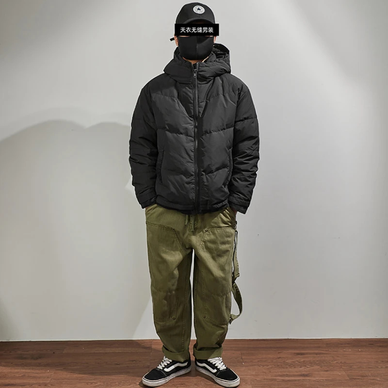 Hooded down jacket men's fake two pieces of loose shoulder sleeves in winter, the new warm outer wear black stitching jacket.