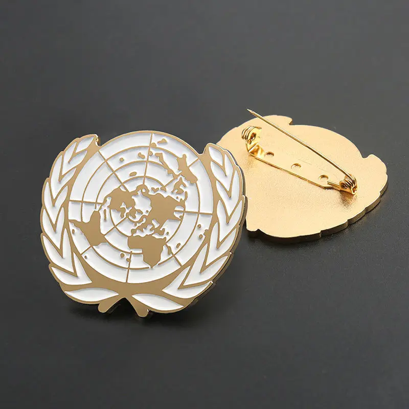 

Металлическая брошь Организации Объединенных Наций