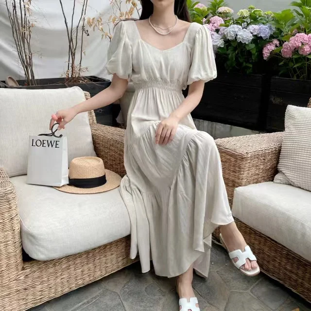 

South Korea chic French summer niche design sense pleated bubble sleeve exposed collarbone waist slimming long dress
