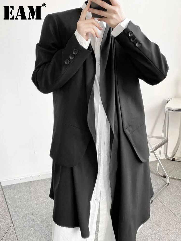

[EAM] Women Black Irregular Hem Big Size Trench New Lapel Long Sleeve Loose Fit Windbreaker Fashion Spring Autumn 2023 1DF0933