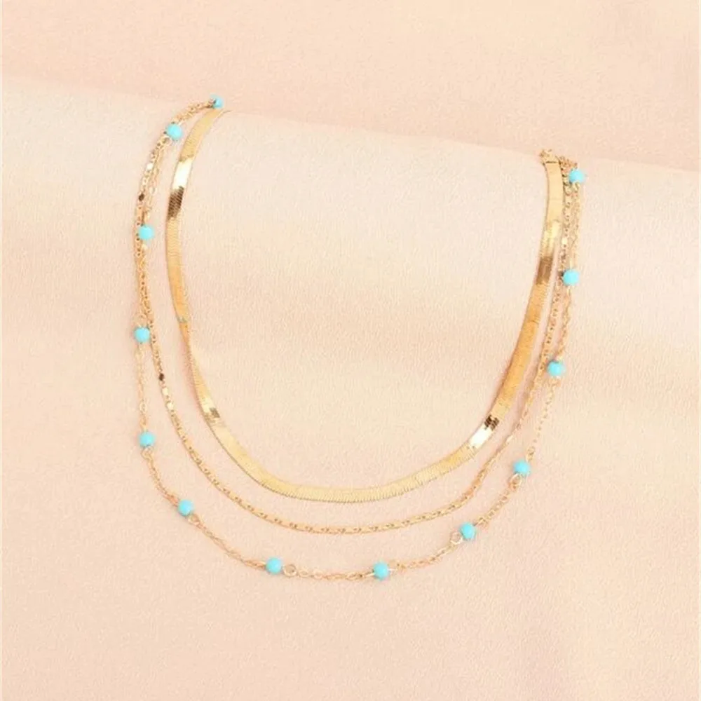 

Модная простая Золотая Геометрическая цепочка в виде змеи, бирюзовый кулон из бисера, ожерелье для женщин, женское винтажное Многоуровнево...