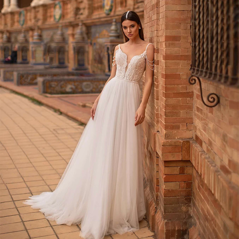 

Boho Wedding Dresses V-Neck Sleeveless Spaghetti Straps Lace Applique Zipper Backless Bride Gown Beading A-Line Vestido De Noiva