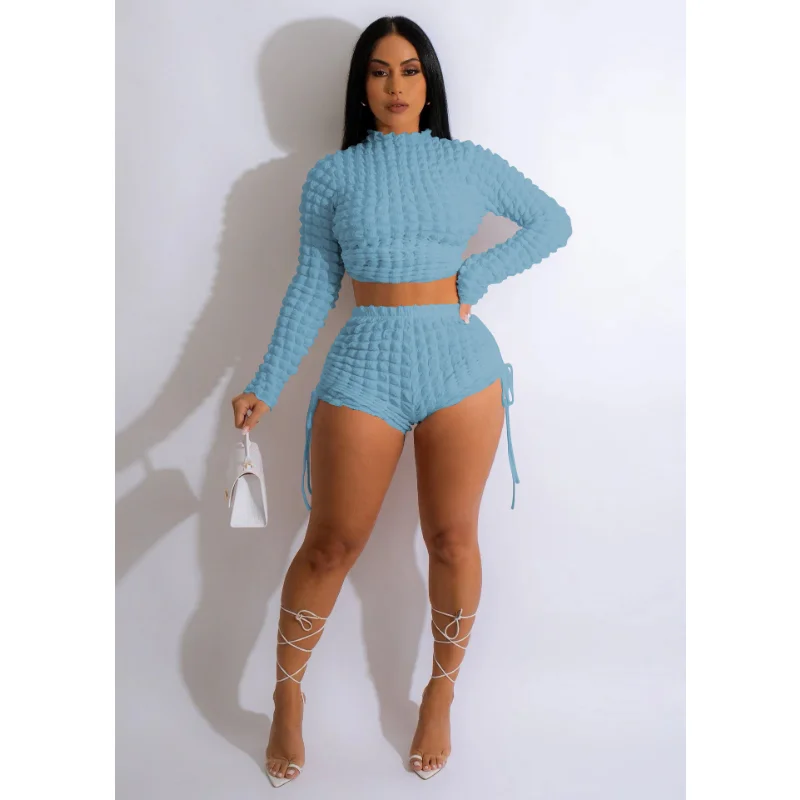 

Женский однотонный костюм из двух предметов, короткий топ с длинным рукавом и шорты на шнуровке