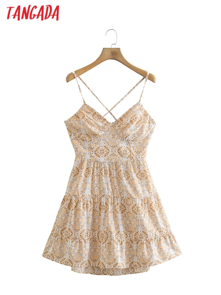 

Женское мини-платье с цветочным принтом, бантом и открытой спиной