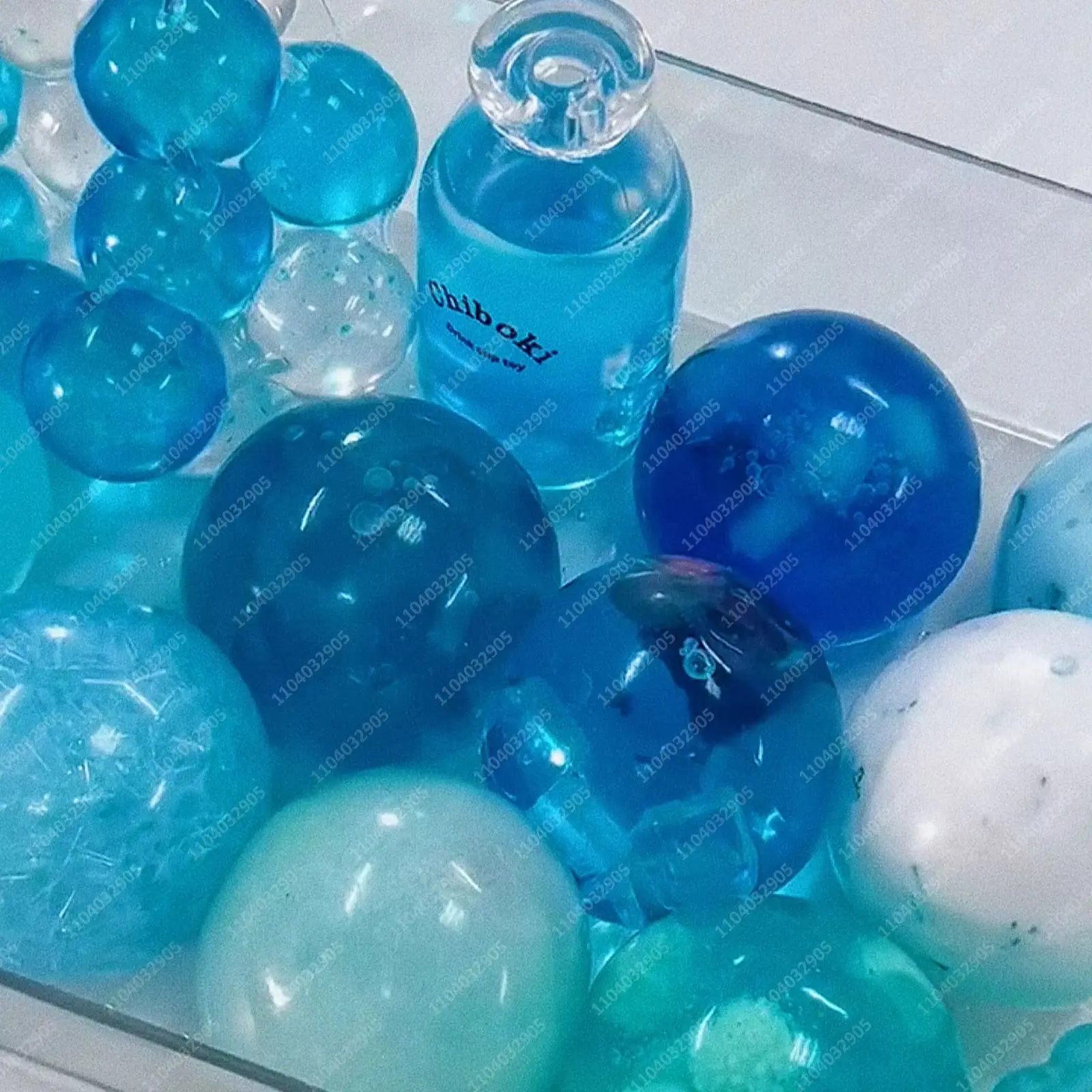 Фото Мяч-антистресс Ocean Blue Slushie в форме бутылки, тянущийся, хрустящий, сжимаемый, сенсорная игрушка ASMR для взрослых №1