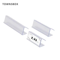 clear plastic shelf edge talker label sleeve wood edge sign and ticket holder clips on to shelves in supermarket