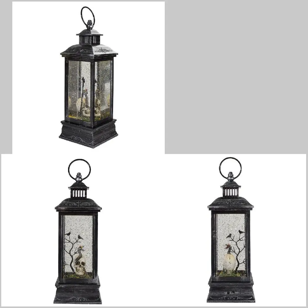 

Strikingly Chic Brushed Silver and Black LED Skull Snow Globe Lantern for Spooky Halloween Home Decorating.