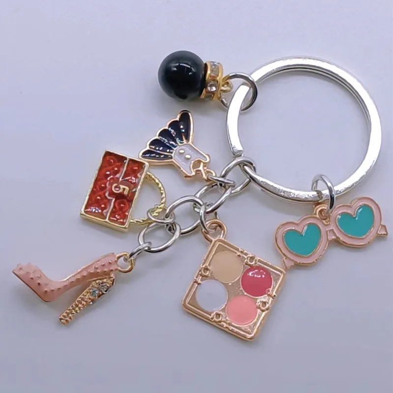 Новый брелок-подвеска Шарм Восхитительная мода Стразы Высокие каблуки Сумка Юбка Косметический чехол Очки Аксессуары Дамские украшения.