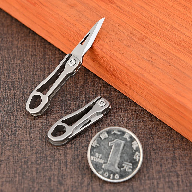 

Mini Titanium Alloy Folding Knife Portable Small Blade EDC Keychain Pendant Express Unpacking Pocket Knife Gift EDC Tool