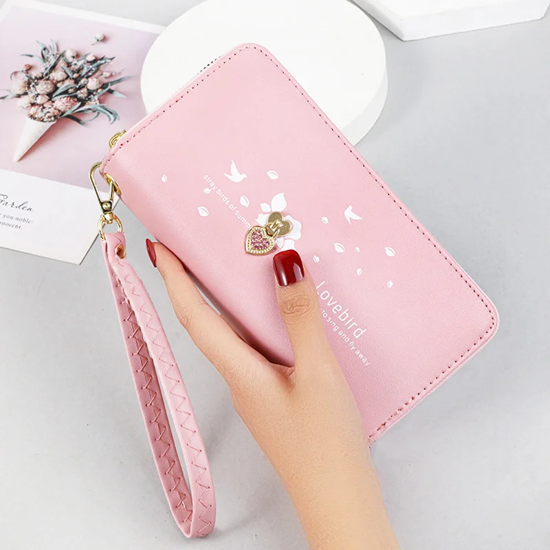 

Long wallet female 2021 new high-capacity student mobile phone bag female love printed wrist band handbag