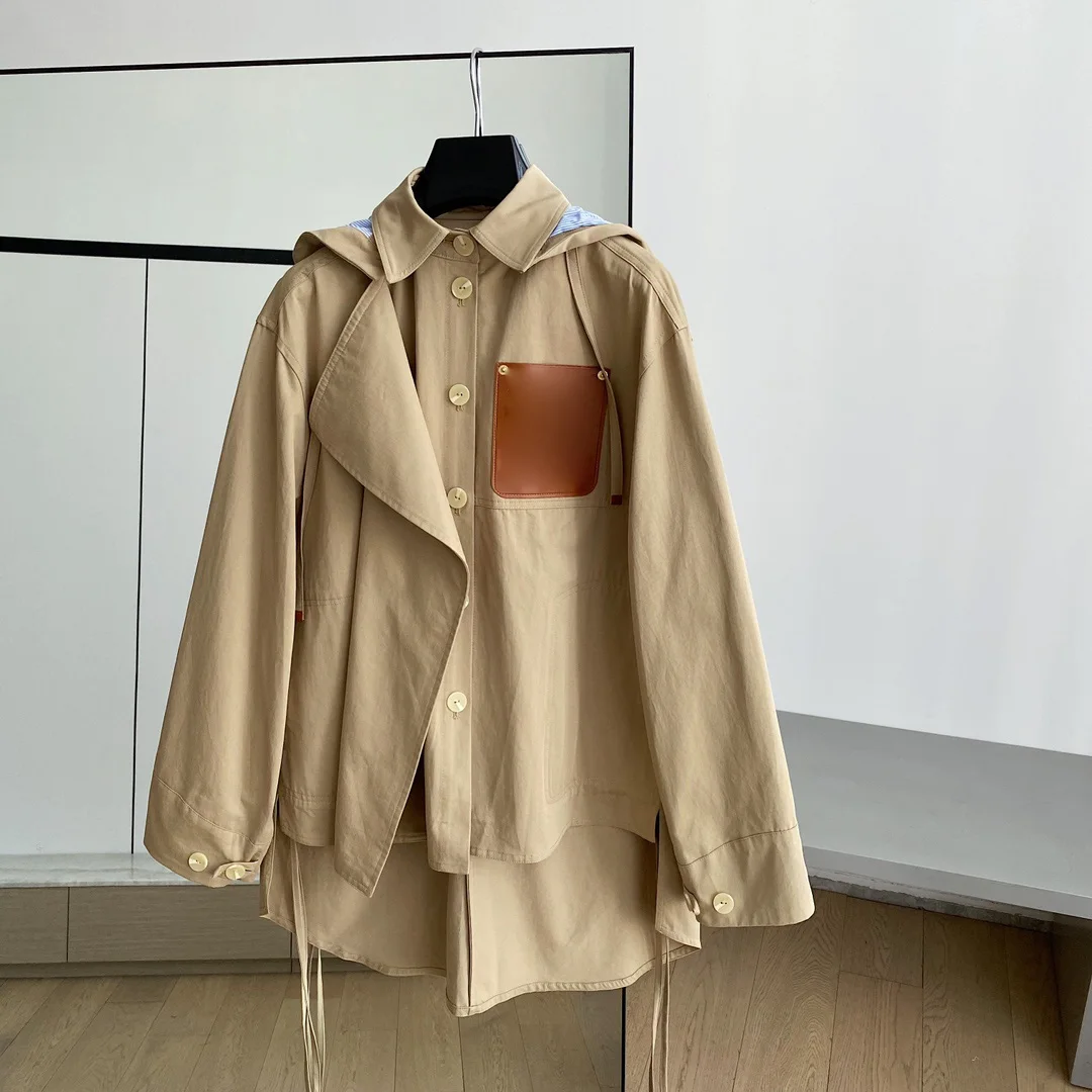 The new fall and winter baggy trench coat with hood is classic versatile