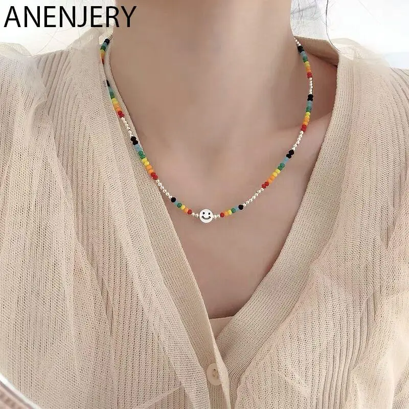

Женское многослойное ожерелье ANENJERY, серебристого цвета с бусинами и улыбающимся лицом на цепочке до ключиц