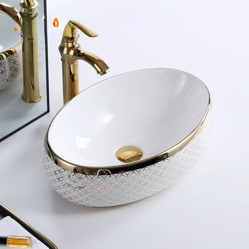 

Wholesale decorative no hole oval gold golden luxury hotel ceramic table top bathroom sink wc hand wash art basin Bathroom sink