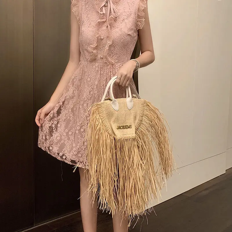 European And American Fashion Tassel Straw Bag 2023 New Summer Vacation Beach Bag With Raw Edge Lafite Handheld Woven Womens Bag