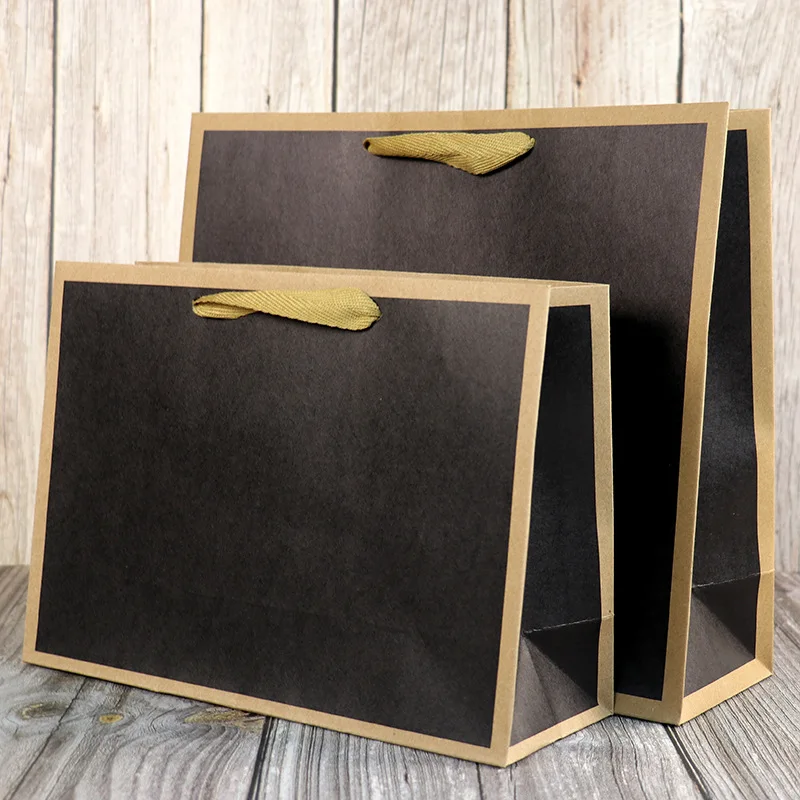 

Wholesale of New Kraft Paper Bags and Gift Bags High Bearing Fashion Clothes Shop Handbag Gift Packaging Handheld Paper Bag