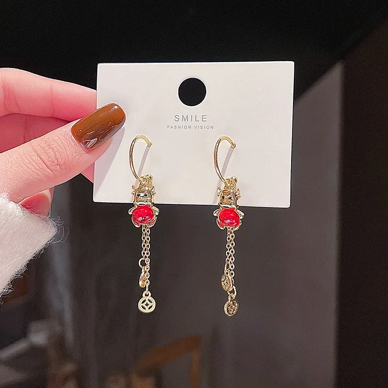 

Серебряные длинные серьги-подвески с изображением Зодиака быка