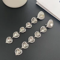 timeless wonder shiny zirconia heart clip on earrings for women designer jewelry runway luxury brand sweet tassel top long 6325