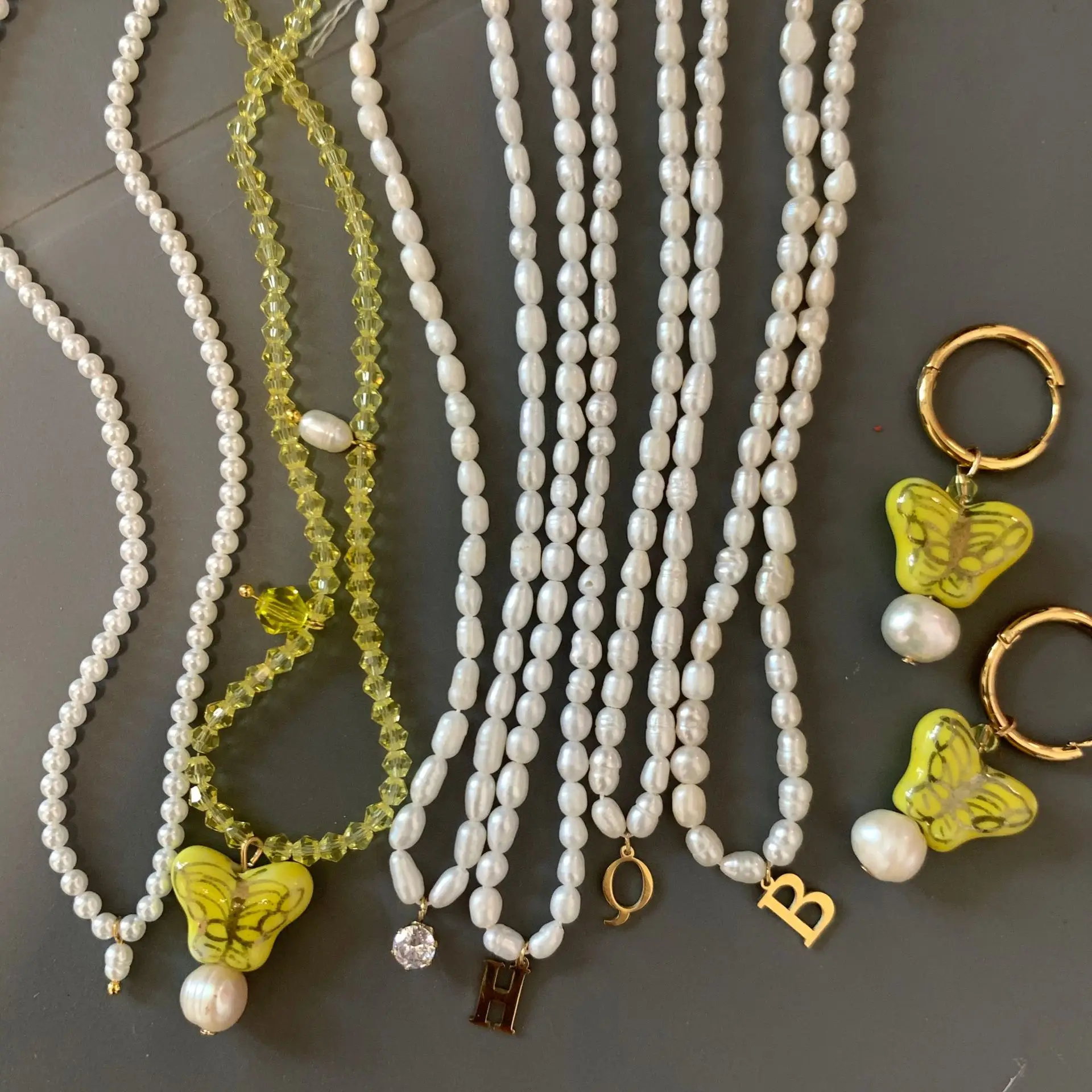 

Natural Freshwater Pearl Letter Necklace Design Yellow Crystal Butterfly Pearl Necklaces Simple Style Female