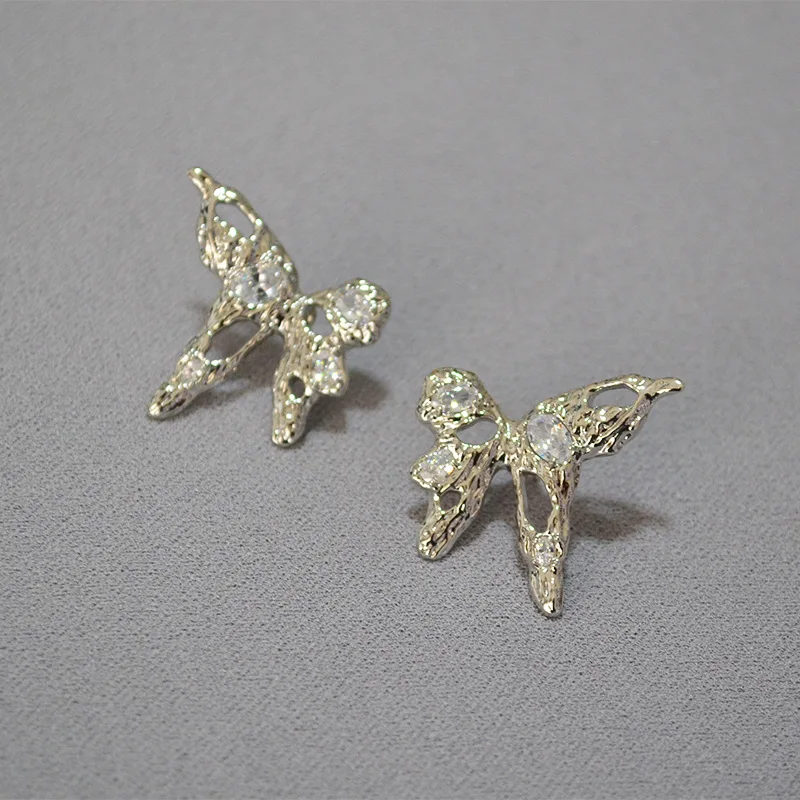 

European and American creative design metal texture liquid butterfly zircon flash 925 silver needle stud earrings earrings