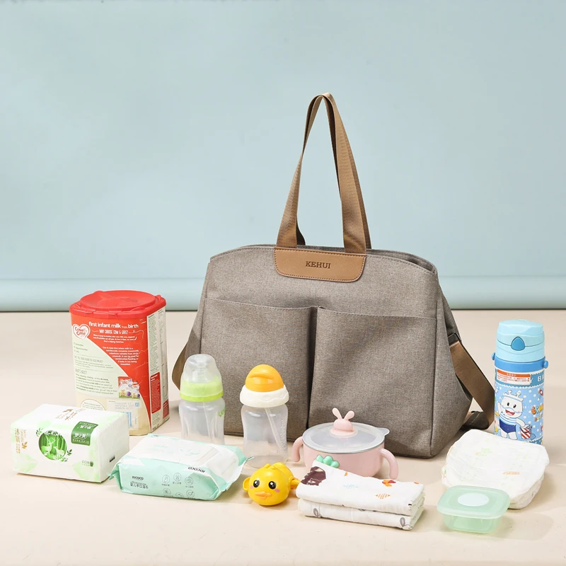 Przenośna wielofunkcyjna torba na pieluchy z zamkiem błyskawicznym i dużą pojemnością dla niemowląt marki Upnzt