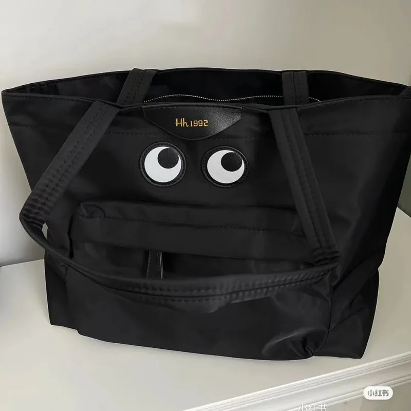 

Korean style niche student commuter tote bag fashionable casual smiley bag with eyes large capacity canvas shoulder handbag