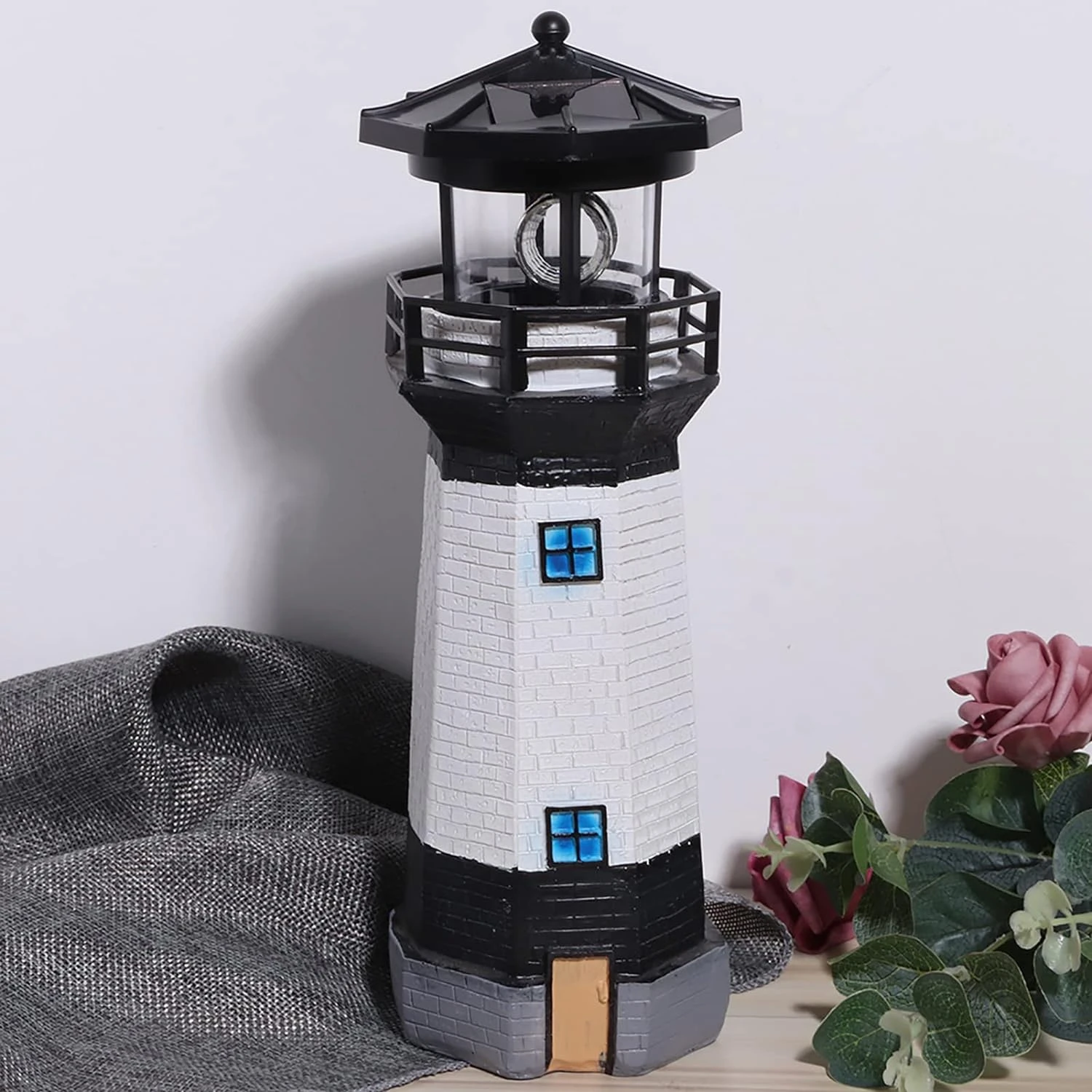 Stylish modern and mesmerizing solar-powered lighthouse to enhance your outdoor space. Illuminate surroundings with warm