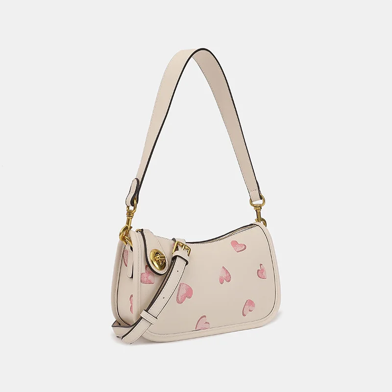 

Женская сумка через плечо с принтом сердца