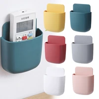 wall mounted organizer storage box remote control mounted mobile phone plug wall holder charging multifunction holder stand