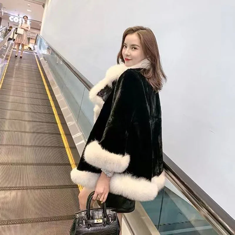 2022 autumn and winter new loose imitation fur black and white stitching warm air fashion all-match cape coat women