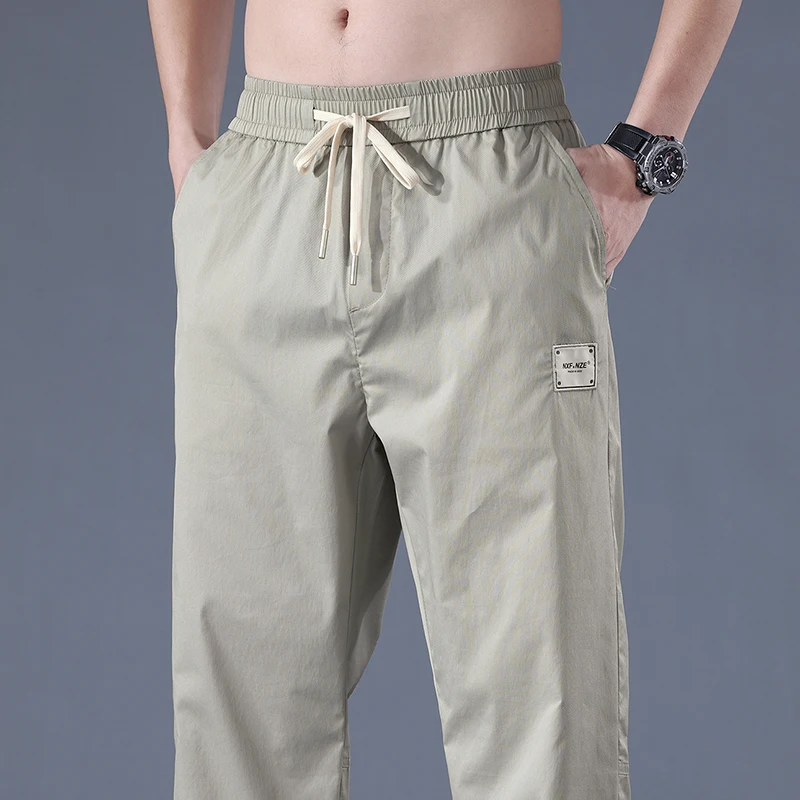 

Spring Summer New Loose Drawstring Waist Men's Elastic Slim Straight Tube Trend All Match Denim 2023 Chic Casual Pants Man