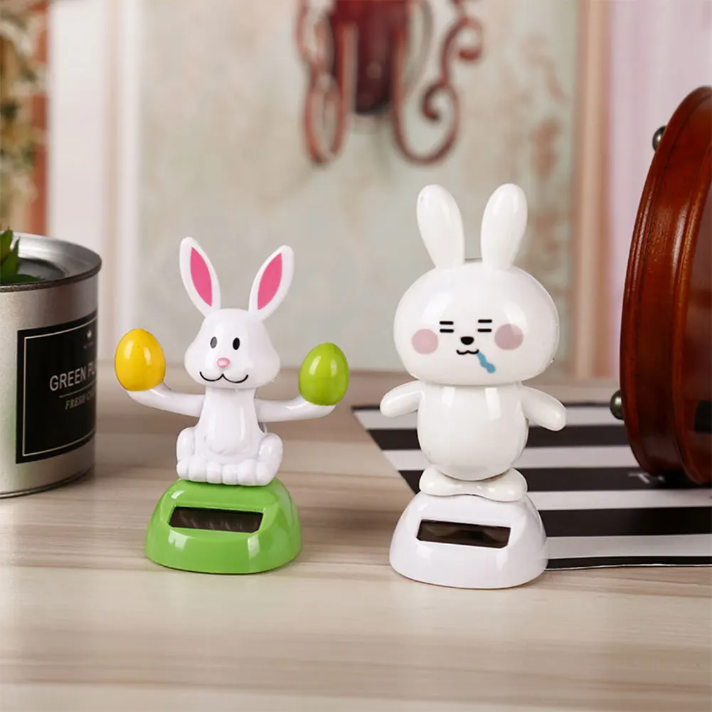 

Мультяшная вращающаяся голова кролик украшения приборной панели питание от солнечной батареи Вращающаяся головка для автомобиля кукла ис...