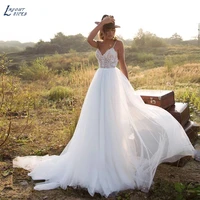 layout niceb bohemian tulle spaghetti straps wedding dresses sleeveless lace applique sweep train deep v neck bridal gown